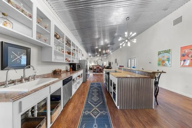 a kitchen with a sink and cabinets