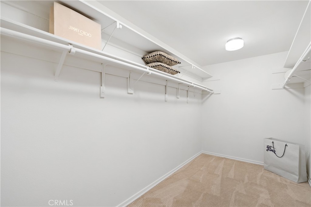 11687 Bellagio Road, Unit 12 Los Angeles, CA 90049 - Photo 22 of 50 Primary suite includes a large walk-in closet plus an additional closet