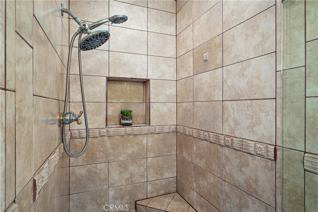 11687 Bellagio Road, Unit 12 Los Angeles, CA 90049 - Photo 25 of 50 Primary bedroom includes the separate shower area and private water closet.
