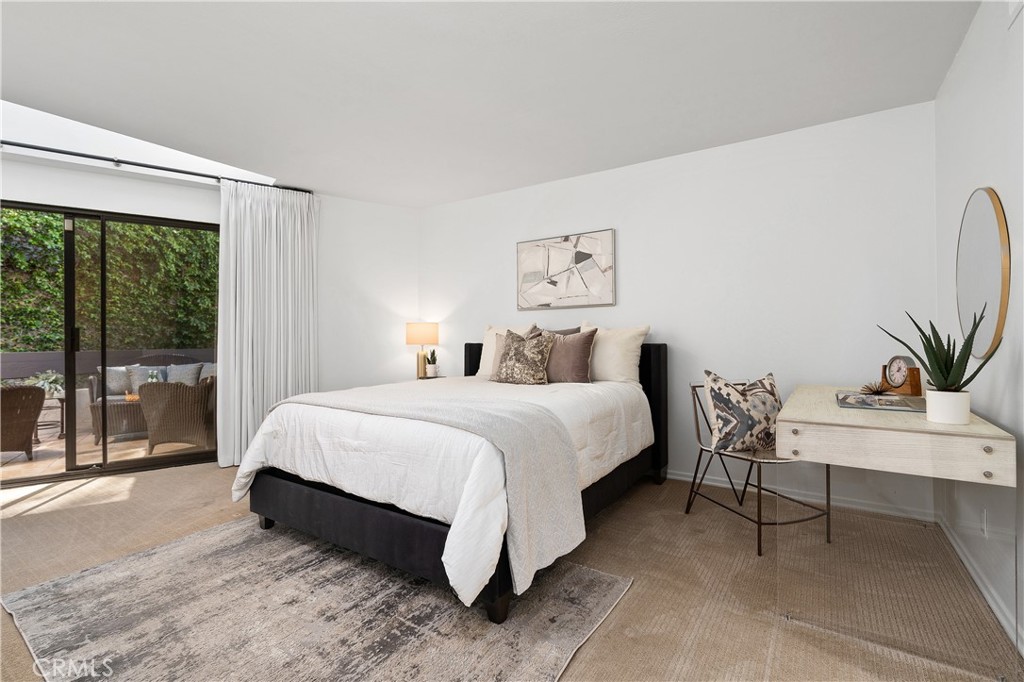 11687 Bellagio Road, Unit 12 Los Angeles, CA 90049 - Photo 31 of 50 Second bedroom suite complete with its own walk in closet and full bath with enclosed shower and water closet, offering flexibility for guests, extended stays, or creative pursuits.