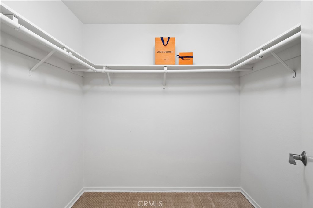 11687 Bellagio Road, Unit 12 Los Angeles, CA 90049 - Photo 34 of 50 Second bedroom suite with walk-in closet.