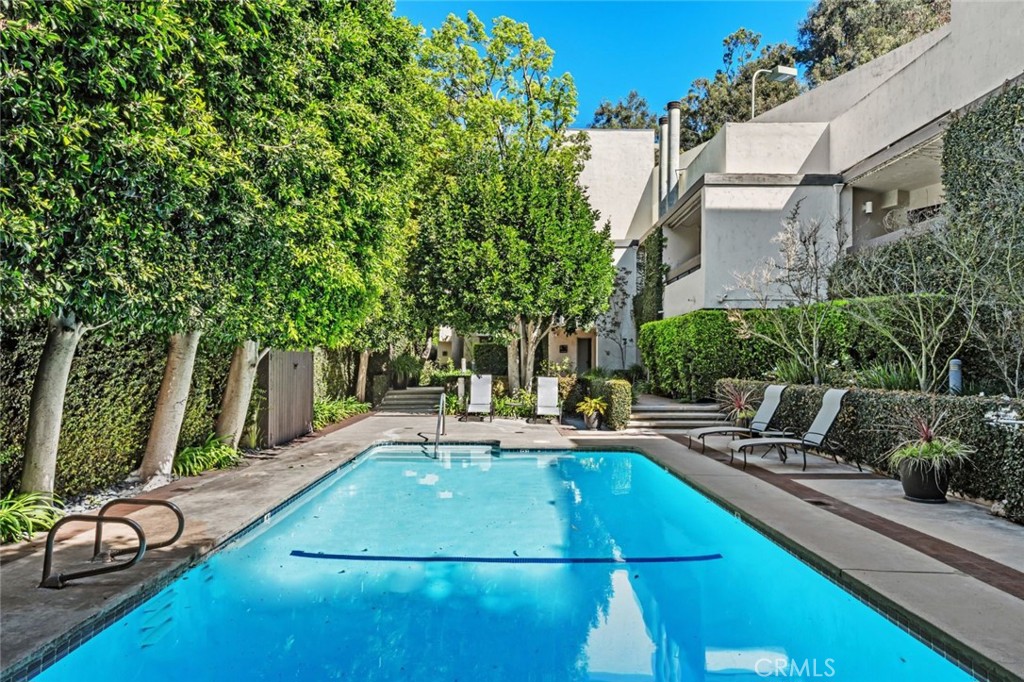 11687 Bellagio Road, Unit 12 Los Angeles, CA 90049 - Photo 41 of 50 Tree-lined pool for privacy