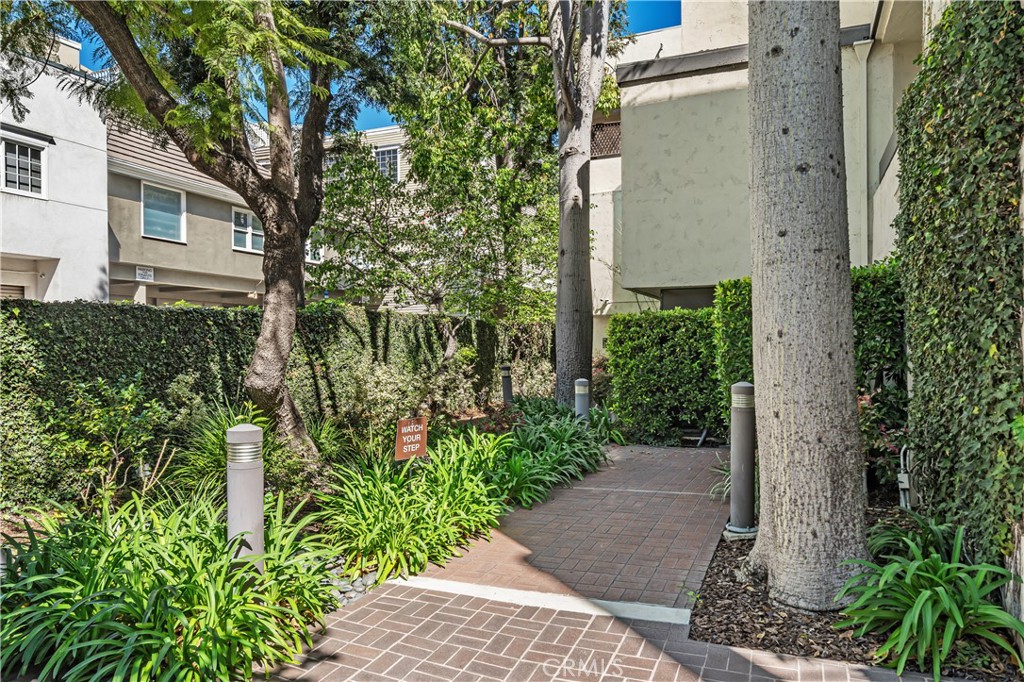 11687 Bellagio Road, Unit 12 Los Angeles, CA 90049 - Photo 42 of 50 Walkway from pool to elevator