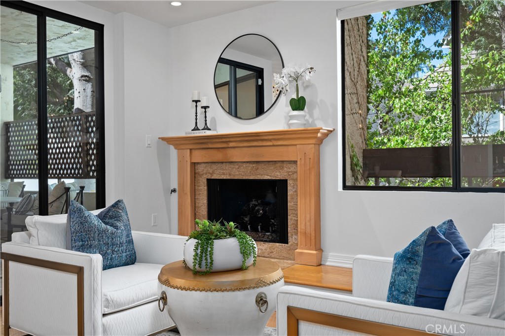 11687 Bellagio Road, Unit 12 Los Angeles, CA 90049 - Photo 5 of 50 At night, relax by the fireside while taking in the Getty beautifully illuminated in the distance.