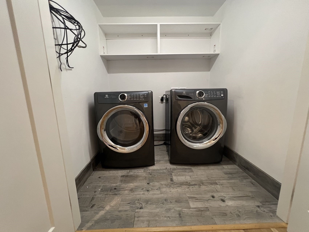 23 Winslow Road, Unit 1 Brookline, MA 02446 - Photo 23 of 27 a utility room with sink dryer and washer