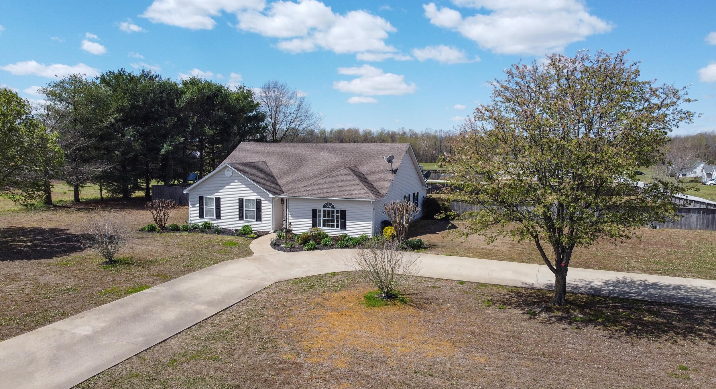 2086 Arlan Reason Road Bells, TN 38006 - Photo 1 of 24 a view of a house with a tree in the background