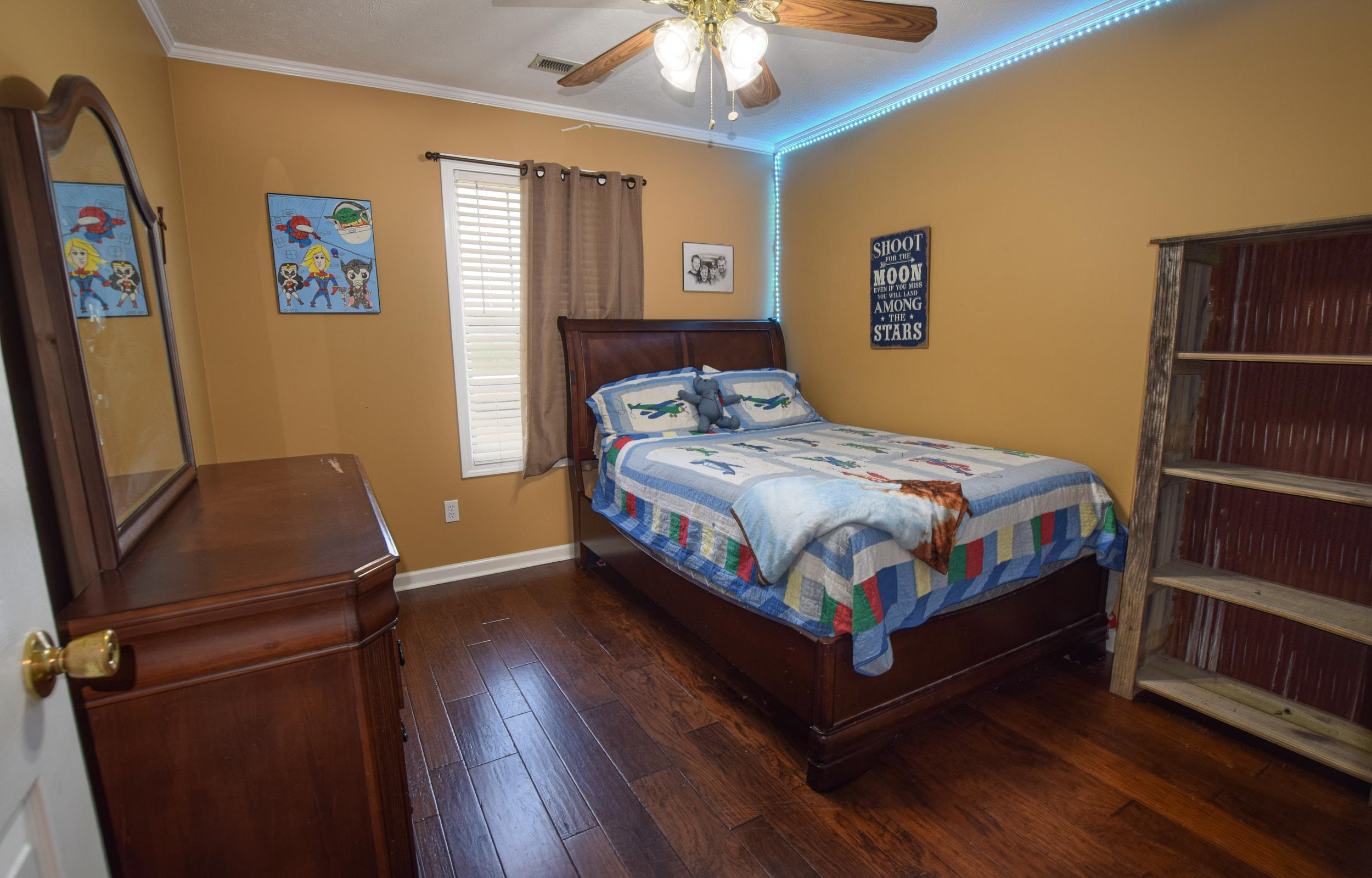 2086 Arlan Reason Road Bells, TN 38006 - Photo 21 of 24 a bedroom with a bed and a chandelier