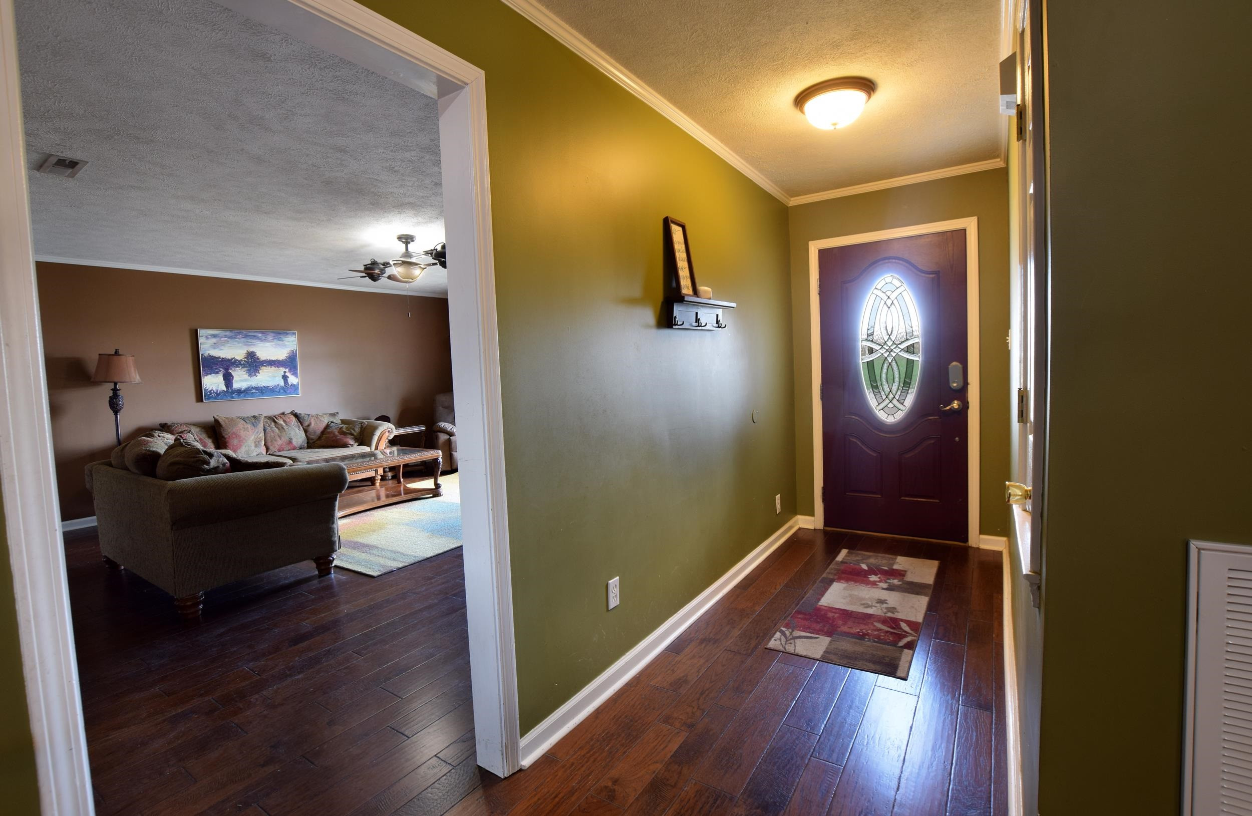 2086 Arlan Reason Road Bells, TN 38006 - Photo 8 of 24 a living room with furniture and wooden floor