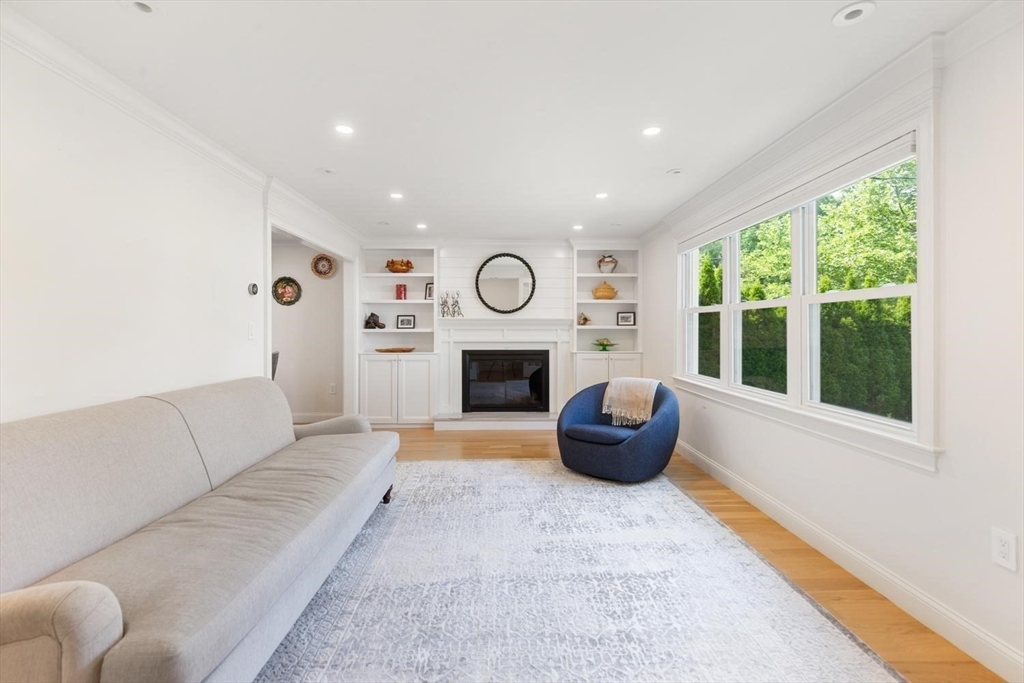 155 Adams Avenue Newton, MA 02465 - Photo 4 of 37 a living room with furniture and a fireplace