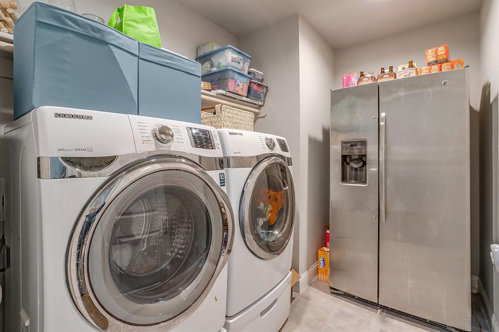 15141 Fleet Hill Road Aledo, TX 76008 - Photo 27 of 37 Laundry room includes full size hookups plus space for refrigerator freezer.