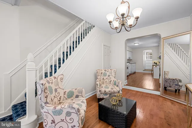 a living room with furniture chandelier and a chandelier