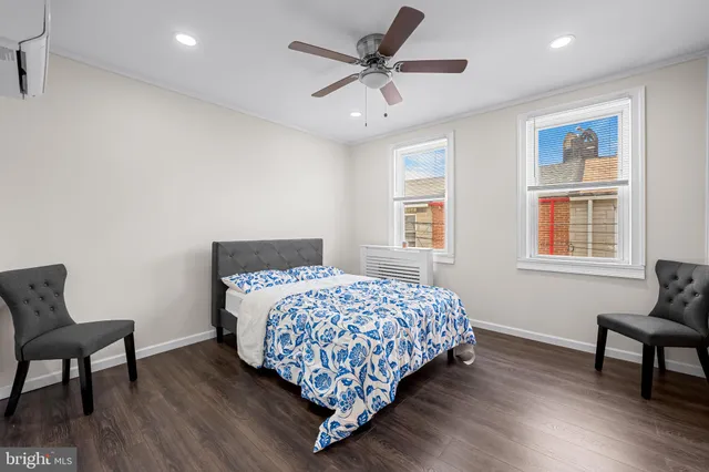 a bedroom with bed and window