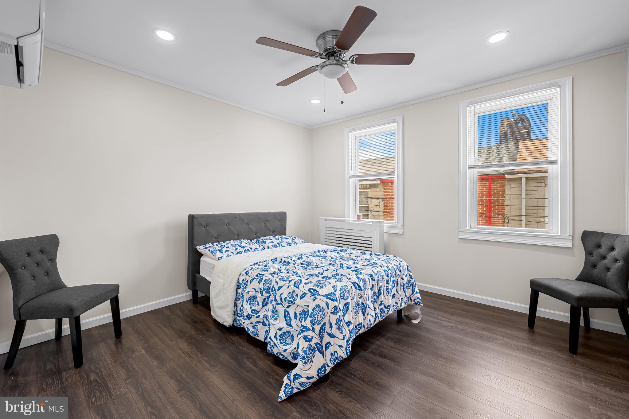 417 South Madeira Street Baltimore, MD 21231 - Photo 19 of 33 a bedroom with bed and window