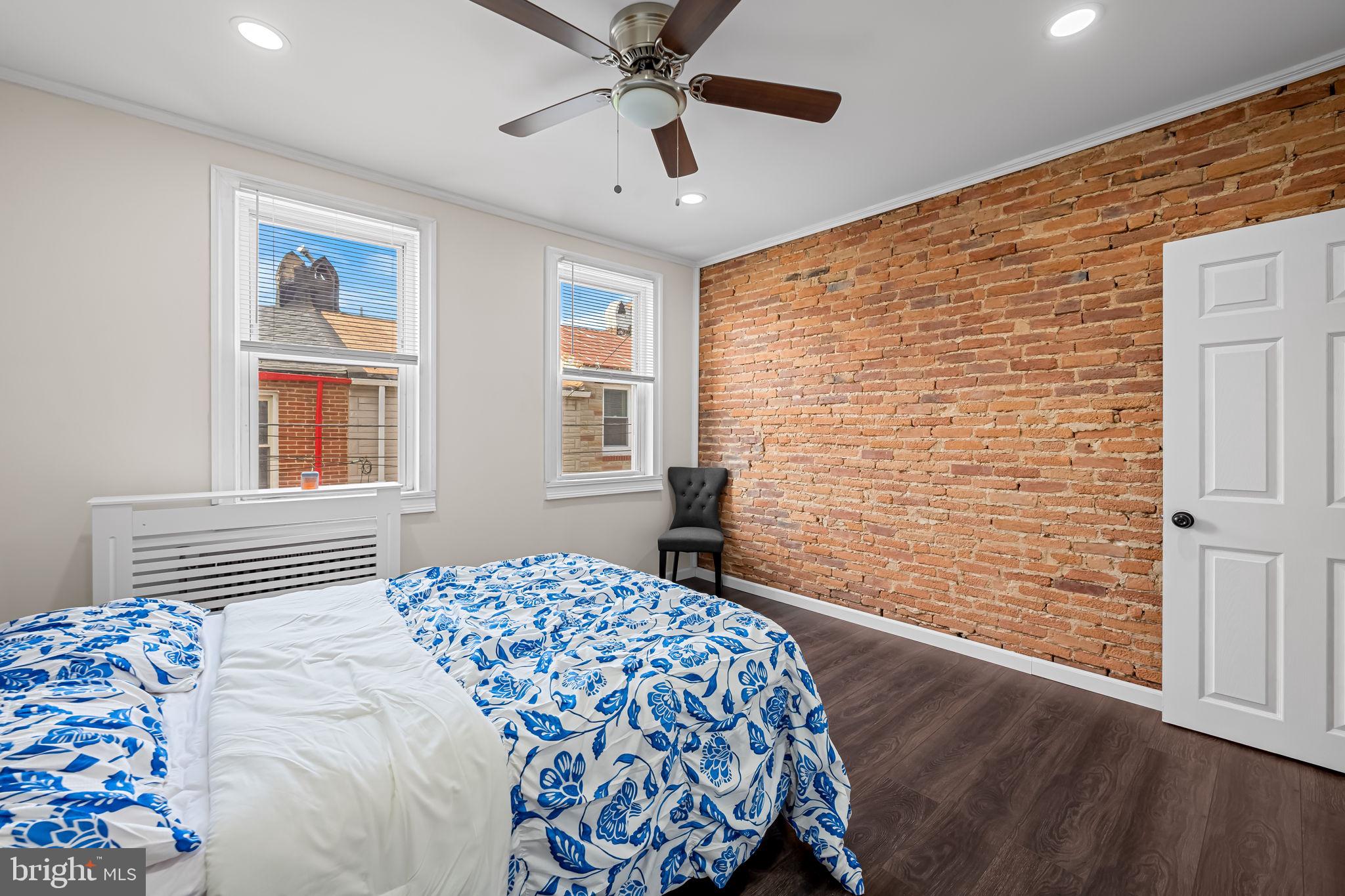 417 South Madeira Street Baltimore, MD 21231 - Photo 21 of 33 a bedroom with a bed and a window