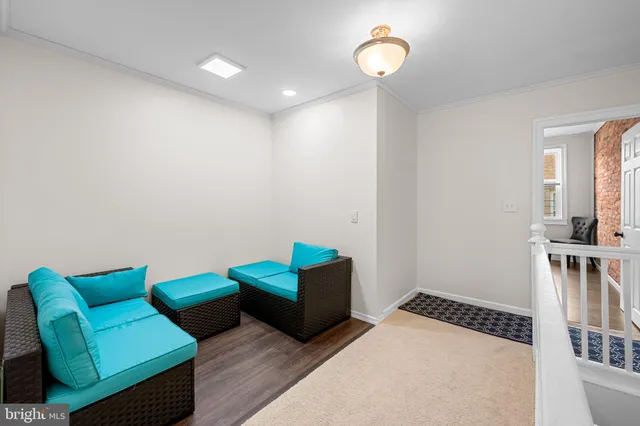 a living room with furniture and a rug