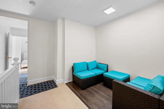 a bedroom with furniture and a rug