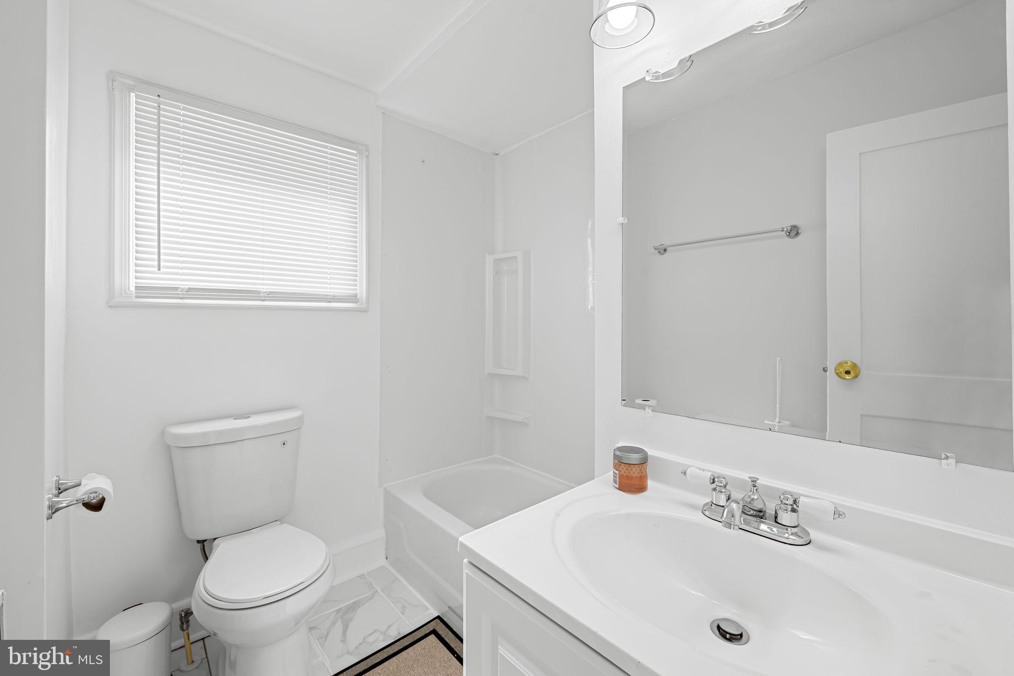 417 South Madeira Street Baltimore, MD 21231 - Photo 25 of 33 a bathroom with a sink a toilet and a mirror
