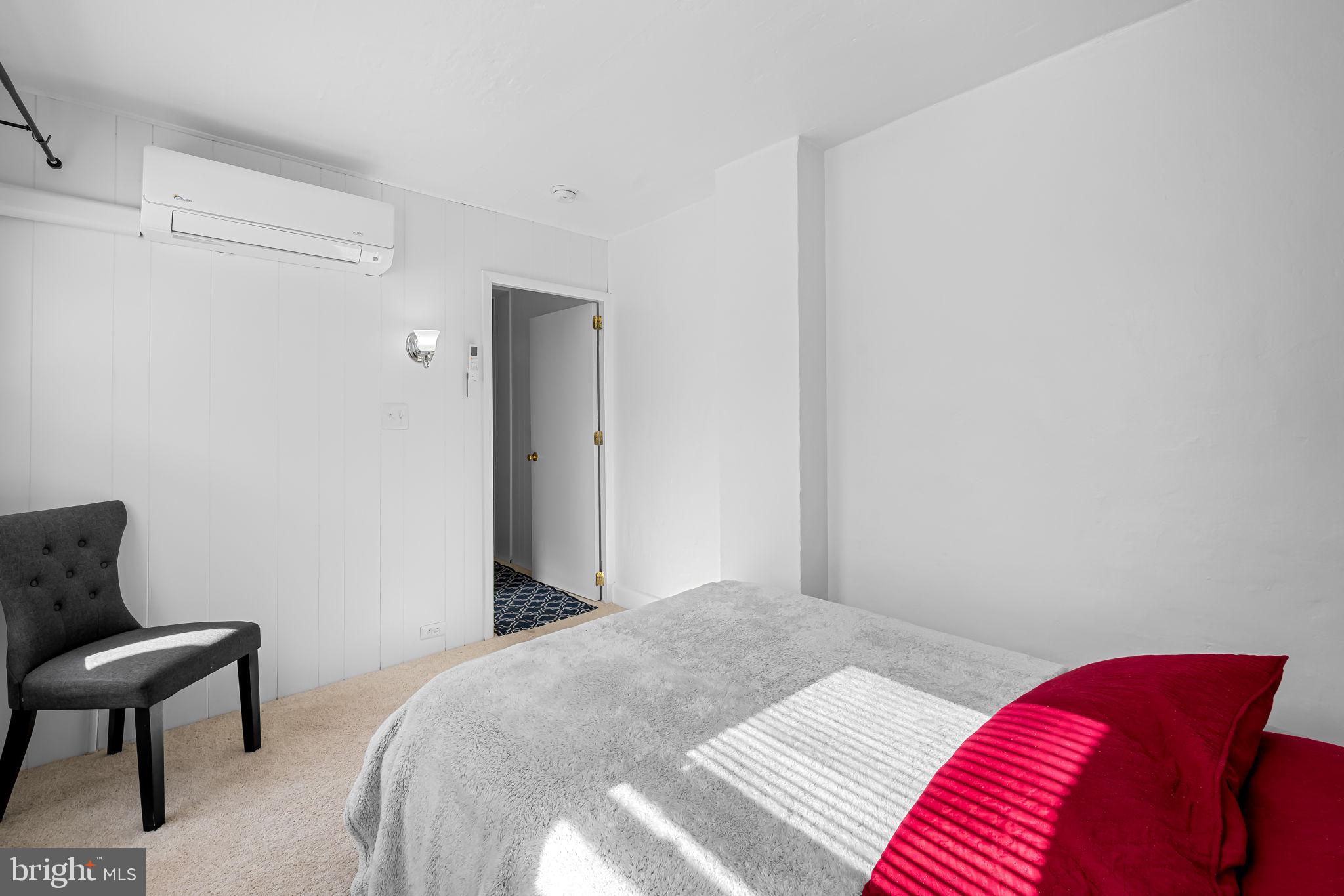 417 South Madeira Street Baltimore, MD 21231 - Photo 27 of 33 a bedroom with a bed and a chair