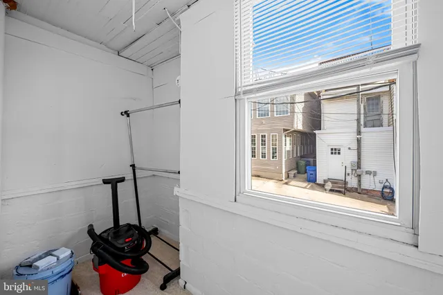 a bathroom with a sink and a window