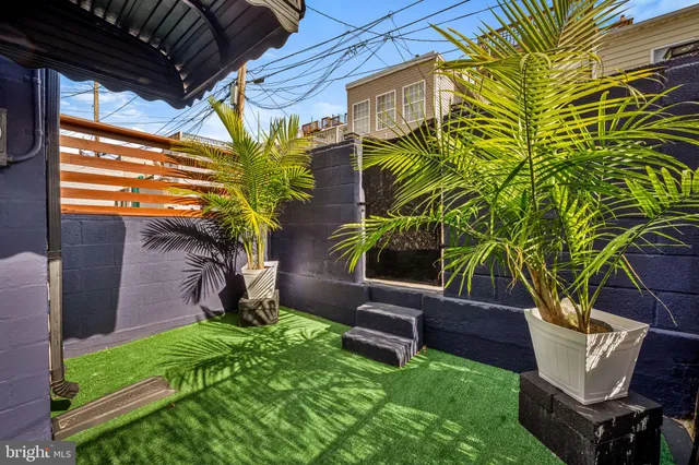 a backyard of a house with seating space