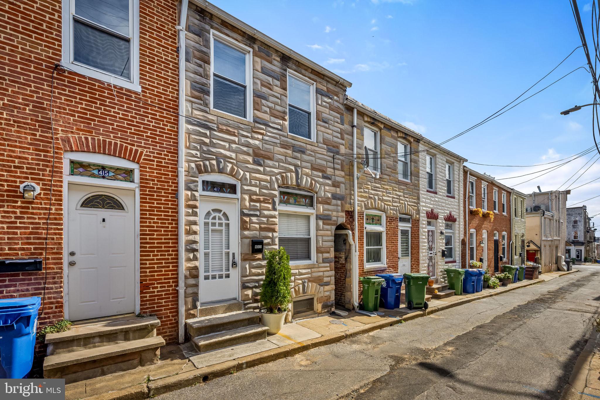 417 South Madeira Street Baltimore, MD 21231 - Photo 5 of 33 a front view of a building with street