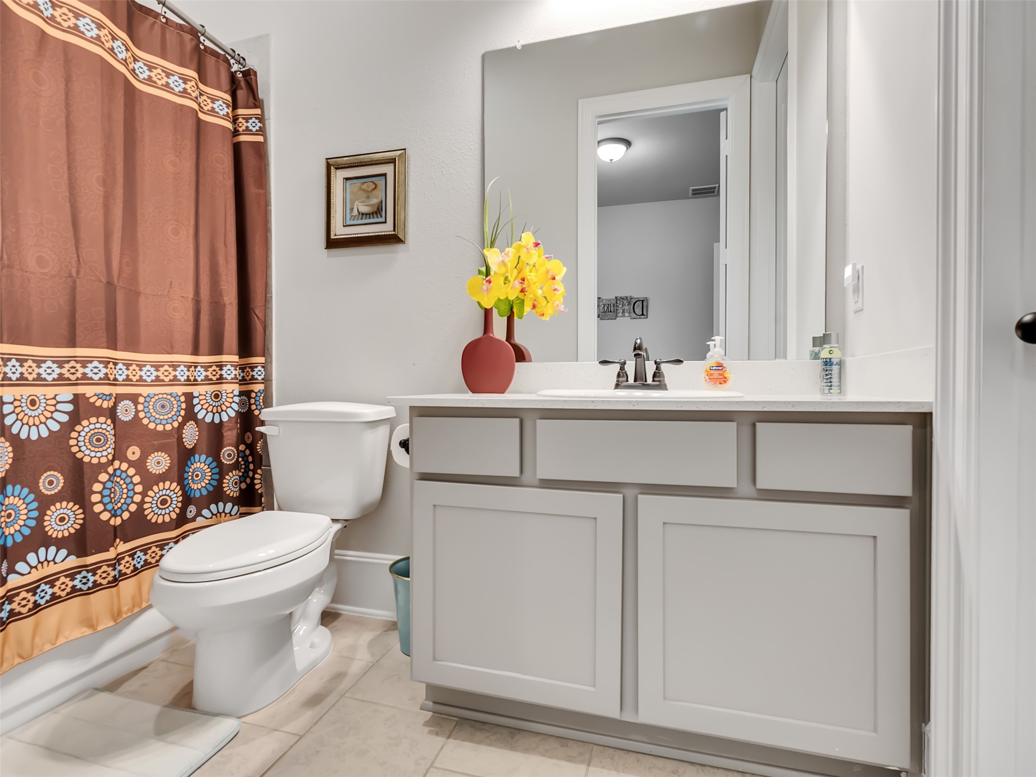 10302 Muir Peak Drive Rosharon, TX 77583 - Photo 23 of 40 Guest bathroom with modern vanity with white cabinetry.