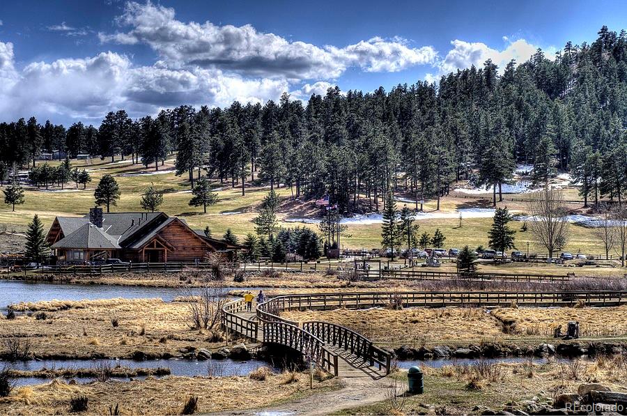 4094 Alpine Drive Evergreen, CO 80439 - Photo 23 of 39 a view of a lake with lots of trees