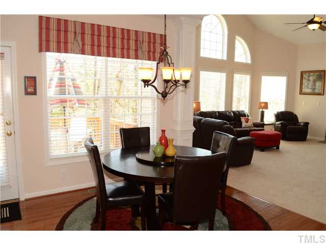 4457 Fairview Ridge Lane Apex, NC 27539 - Photo 7 of 25 Aged and oil rubbed bronze lighting highlight the dining spaces.