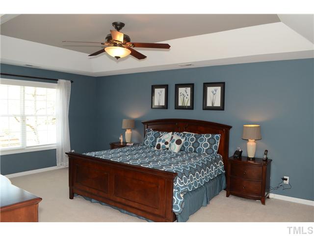 4457 Fairview Ridge Lane Apex, NC 27539 - Photo 10 of 25 Second floor master suite features accentuated tray ceiling, two oversized walk in closets and sumptuous spa bath retreat.