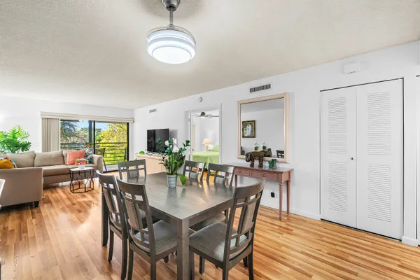 a view of a dining room with furniture and wooden floor