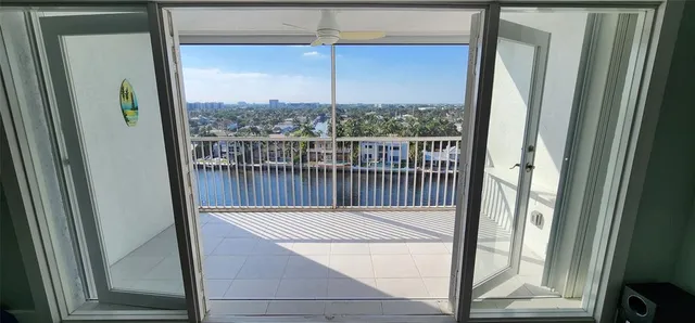 a view of a balcony next to a yard