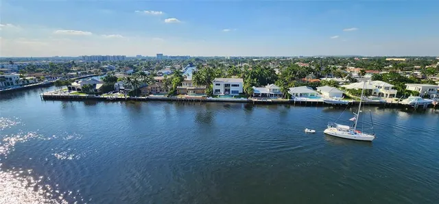a spacious bathroom with a granite countertop sink and a mirror