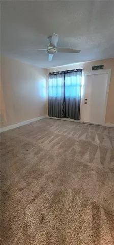 a view of a swimming pool with lounge chair