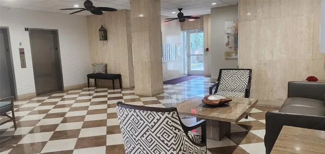 a view of a swimming pool with chairs