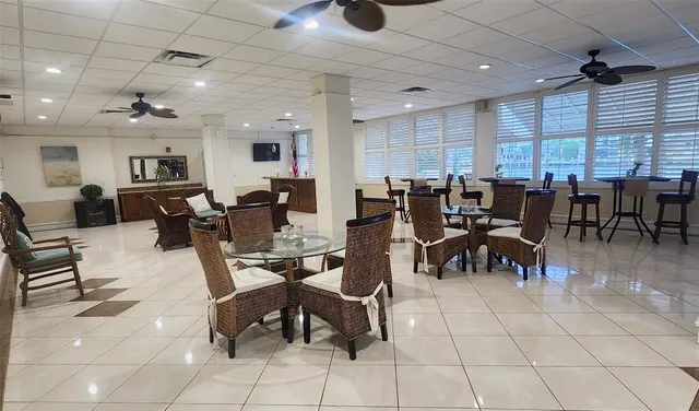 a view of a swimming pool with an outdoor seating