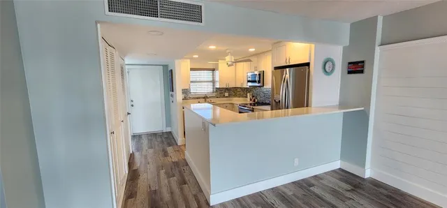 a view of a livingroom with wooden floor