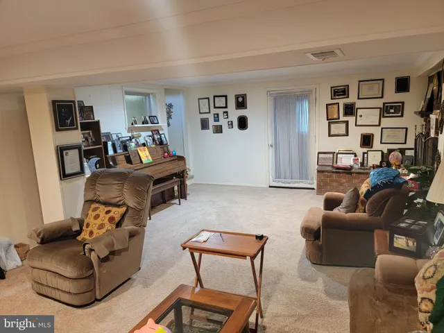 a living room with furniture and a couch