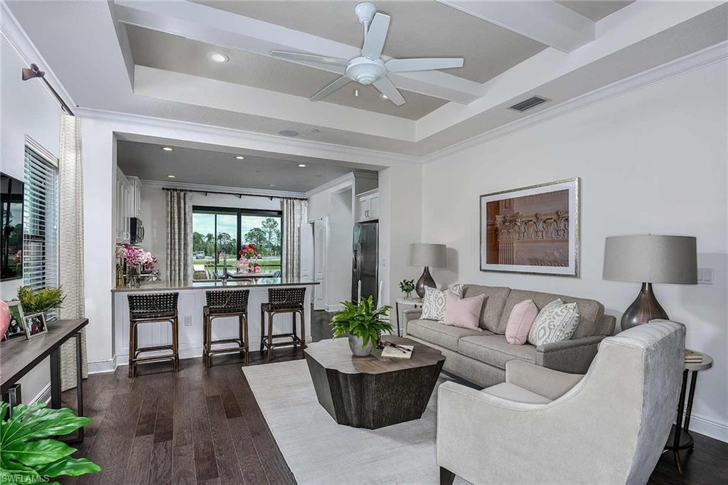 4637 Centaurus Circle Naples, FL 34120 - Photo 2 of 40 a living room with furniture and a large window