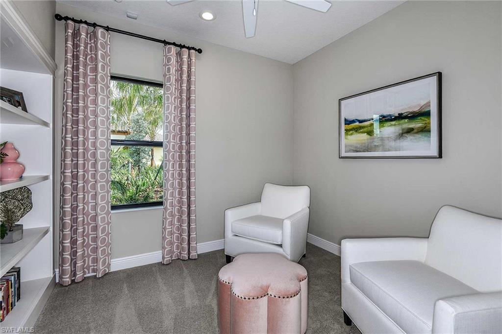 4637 Centaurus Circle Naples, FL 34120 - Photo 22 of 40 a living room with furniture and a toilet