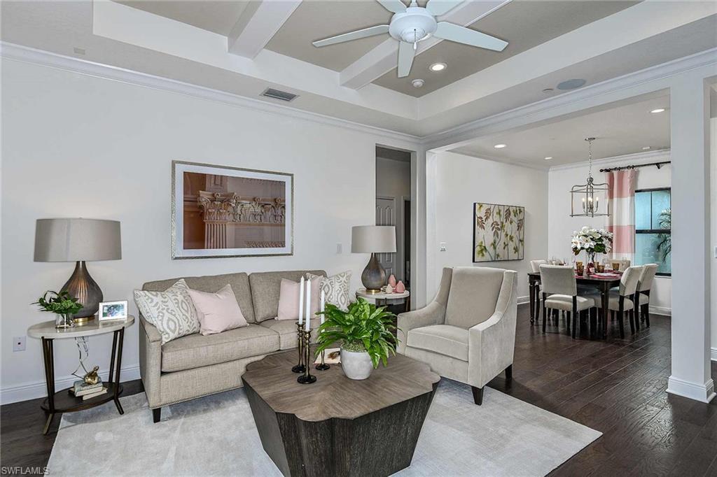 4637 Centaurus Circle Naples, FL 34120 - Photo 4 of 40 a living room with furniture and a wooden floor