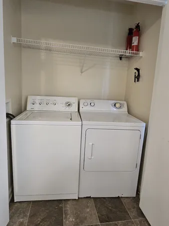 a utility room with dryer and washer