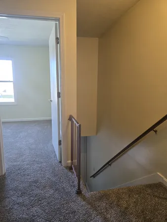 a view of hallway with closet area