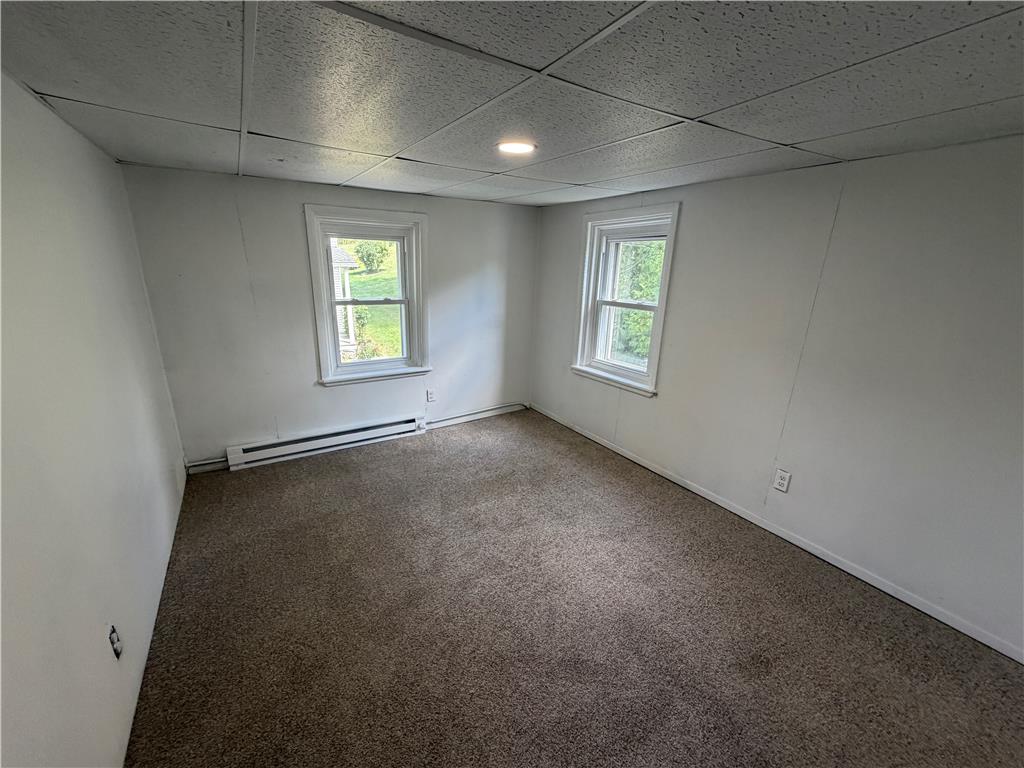 5720 Memorial Road Germansville, PA 18053 - Photo 12 of 30 A quiet bedroom offers dual windows and comfortable carpeting, creating a simple and serene living space.