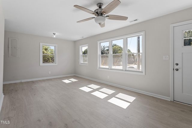 a view of empty room with windows