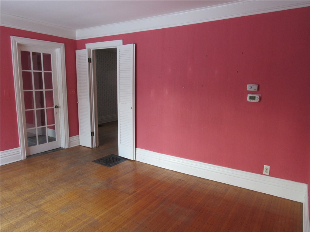 180 Milburn Street Rochester, NY 14607 - Photo 6 of 39 Living Room; shows entry to Dining Room
