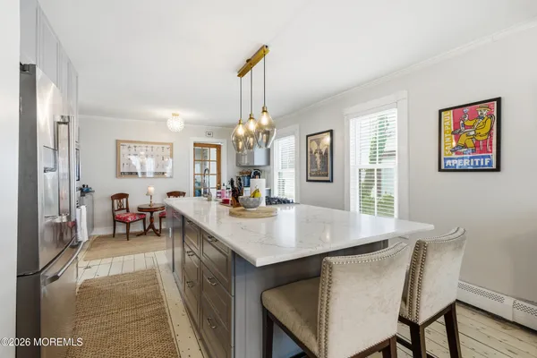 a kitchen with stainless steel appliances a refrigerator and a stove top oven