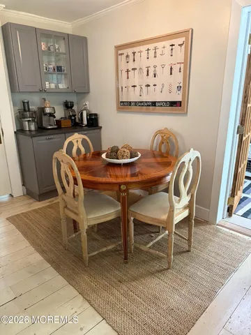 a view of a dining room with furniture and a rug