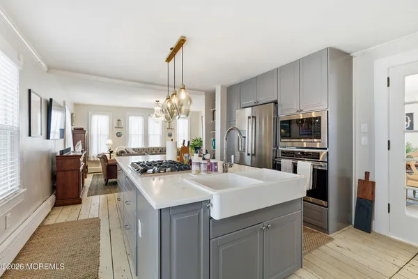 a bathroom with a sink toilet and a mirror