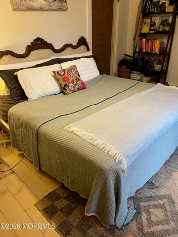 a bedroom with a bed and walk in closet