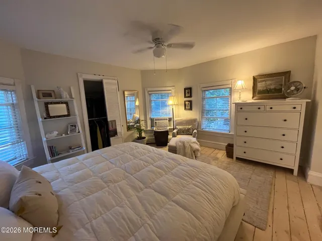 a bedroom with bed and window